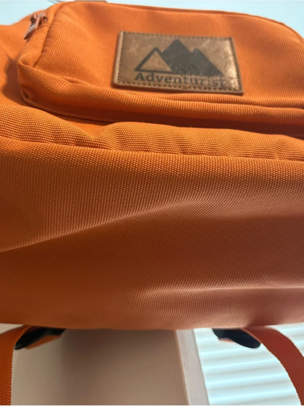 Orange Canvas Backpack with Brown Accents